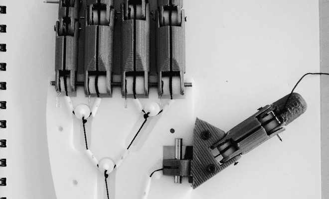 Printed prototype of the hand showing the tendon routing
